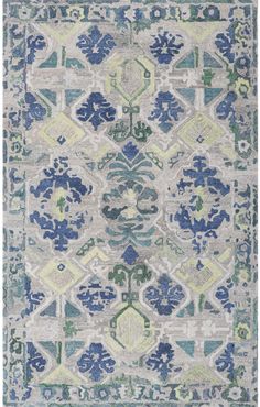 an area rug with blue and green designs