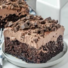 a piece of chocolate cake on a plate with a fork