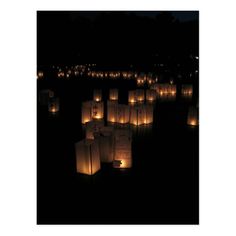 paper lanterns floating in the air at night