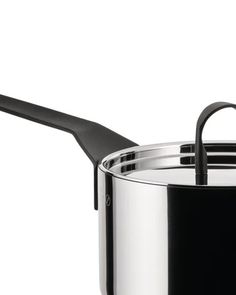 a black pot with a lid and handle on a white background is seen in this image