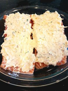 two pieces of food sitting on top of a black plate