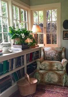 a living room filled with furniture and lots of books on top of a book shelf