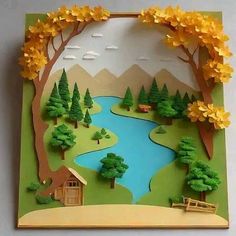 an image of a paper cut landscape with trees