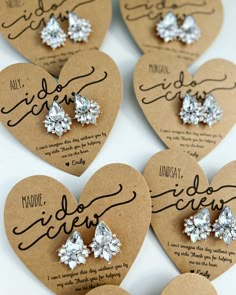 six heart shaped brooches with diamond earrings on them