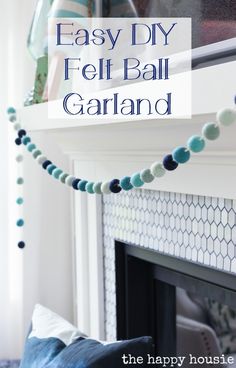 an easy diy felt ball garland hanging from a fireplace mantel with text overlay