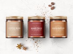 three jars of coffee bean and gingerbread jam on a white surface with cinnamons