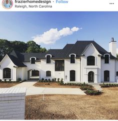 a large white house with lots of windows