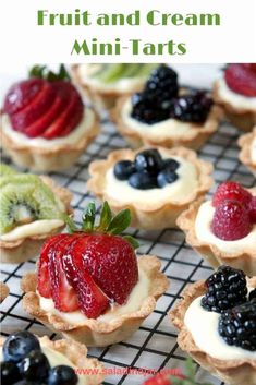 some fruit tarts are on a wire rack