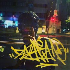 a person with yellow graffiti on their face