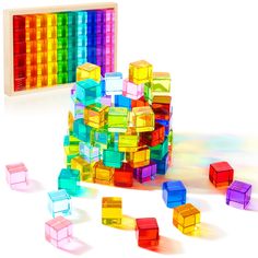 PRICES MAY VARY. What You Will Get: you will receive 60 pieces of rainbow crystal cubes, and they are packed in a safe solid wood storage box; Our rainbow crystal cubes are available in 10 colors, very beautiful and charming, and they will sparkle under the sun and show different colors reflection Beautiful Teaching Aids and Toys: rainbow acrylic cubes are in bright and vibrant colors; When exposed to light, they glow brilliantly, creating a brilliant visual effect; When paired with a light tabl Plastic Cubes, Sorting & Stacking Toys, Rainbow Blocks, Wood Houses, Cube Toy, Wooden Crosses, Wood Storage Box, Christmas Party Gift, Acrylic Gems