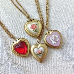 Lovely tiny and UNUSED 70S VINTAGE heart lockets available in different finished (explained below) on dainty gold plated chain measuring 16" (40cm) + 2" =  40cm +5 cm of extender chain.      OPTIONS: 1. Tiny 50s vintage Japanese porcelain heart. 2. Porcelain heart with rust orange rose. 3.  Pink enamelled copper with rose, from the 60s.  4. Red domed heart is first quality plastic.  # 2, 3 &: 4 will hold one picture each side and measure: 14mm x 16mm. ( 0,55" x 0.63"). #1 measures 15x16mm and ha Cheap Vintage Gold Locket Necklace, Vintage Lockets Necklace, Vintage Personalized Charm Necklaces For Wedding, Personalized Vintage Charm Necklaces For Wedding, Vintage Personalized Charm Necklace For Keepsake, Personalized Vintage Charm Necklace For Wedding, Personalized Vintage Pink Jewelry, Vintage Charm Necklaces For Anniversary, Vintage Handmade Heart Pendant Locket Necklace