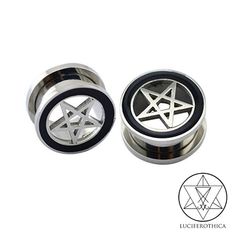 two metal plugs with an inverted pentagramil on the top and black spoke