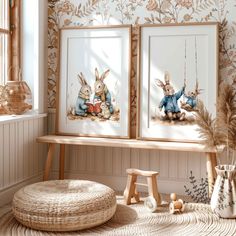 two framed pictures with rabbits on them sitting next to a bench in front of a window