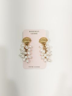 Have a tropical vacation coming up? Be sure to put these beauties on your packing list! This earring is a sea shell stud drop style. It features a gold seashell stud and then multiple mini pearls dangling from below. The earring is about 3.5” in length. Lightweight for longer wear. Tropical Vacation, A Sea, Pearl Drop Earrings, Sea Shell, Pearl Drop, Packing List, Sea Shells, Shells, Drop Earrings