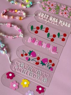 the name tags are decorated with flowers and beads