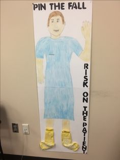 a bulletin board with a drawing of a man in blue shirt and yellow socks on it