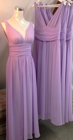 two bridesmaid dresses on display at a wedding