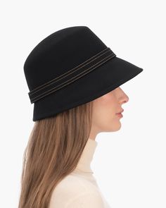 A fashionable women's cloche hat is hand-blocked of the finest superfelt, and then trimmed with a contrast stitch matching band of the same. The ultra sleek silhouette features a rakishly downturned brim, bringing focus to the eyes while framing the face beautifully. Brim span center front: 2.75"(7cm) side: 3"(7.5cm) Designed and finished in the USA Hand-blocked by skilled artisans Sustainable wool and cashmere blend superfelt Elasticized sweatband Adjustable head-size with hidden velcro® featur Gold Sand, Old Rose, Navy Linen, Natural Gold, Cloche Hat, Matching Band, Hats For Sale, Fedora Hat, Contrast Stitch