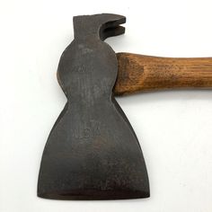 an old hammer with wooden handle on white background