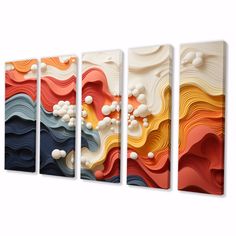 three canvases with different colors and shapes on each one, the wall is made up of