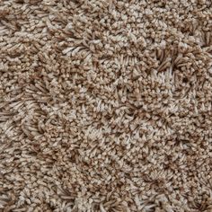 the texture of a carpet is brown and white