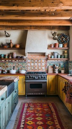 a kitchen with yellow cabinets and an area rug