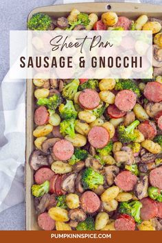 sheet pan sausage and gnocchini with broccoli in it on a table