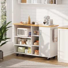 a kitchen with a microwave, toaster oven and other items on the counter top