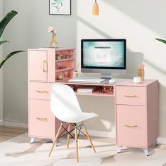 a pink desk with a computer on it and a white chair in front of it