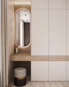 a white closet with a mirror and stool next to it in a room that has wood flooring