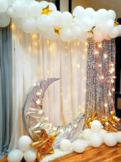 balloon arch with stars and moon on it