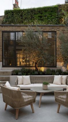 an outdoor living area with seating and trees