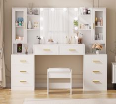 a white desk with drawers and lights on it in front of a large mirror above the counter