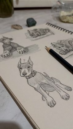 a drawing of a dog sitting on top of a table next to a pen and paper