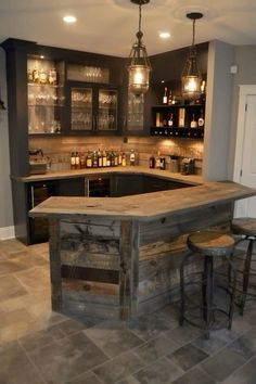 a home bar with stools in the middle