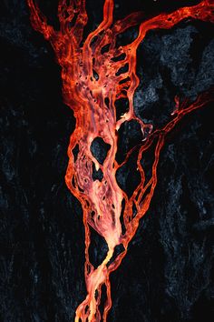 an aerial view of red and black lava