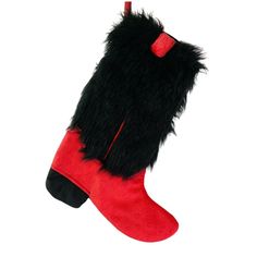 a red and black christmas stocking with furry feet