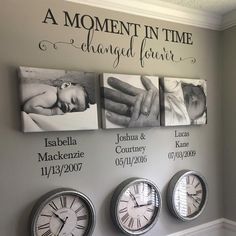 three clocks are hanging on the wall in front of two baby's names and one is