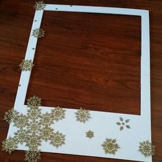 the frame has snowflakes on it and is cut out to look like snow flakes