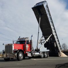 a large truck with a ladder attached to the back