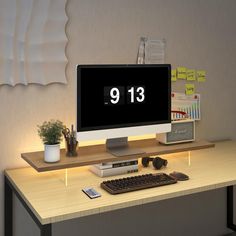 a computer monitor sitting on top of a wooden desk