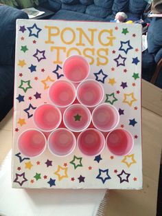 there is a card that says pong tots on the front and six cups in the middle