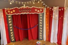 a circus stage with red curtains and lights