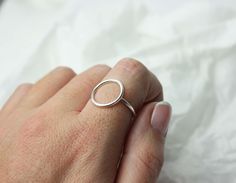 This simple and stylish halo ring is perfect to attract attention. Handmade to order so please allow upto 7 days but do let me know if you need your order for a specific date Each ring is handmade so may vary slightly from the image, that's what makes it so special and unique! I hand make all of my jewellery pieces in my little home workshop in Carnforth, Lancashire. Every item is made with lots of love, care and attention. I LOVE my job and put 100% of myself into creating my jewellery. I do al Handmade Promise Rings, Minimalist Halo Ring Jewelry, Minimalist Halo Design Ring, Minimalist Halo Design Ring With Round Band, Handmade Everyday Rings With Round Band, Simple Handmade Stackable Rings, Handmade Simple Round Rings, Simple Handmade Round Rings, Minimalist Sterling Silver Halo Ring