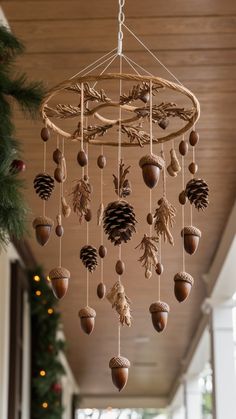 pine cones and acorns are hanging from a chandelier in a house