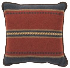 a red and blue striped pillow on a white background