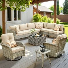 an outdoor living room with wicker furniture