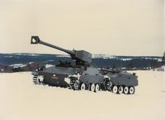 an army tank sitting on top of snow covered ground