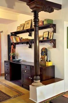 a living room filled with furniture and bookshelves next to a wall mounted shelf