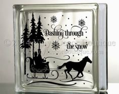 a glass block with an image of a horse pulling a sleigh in the snow